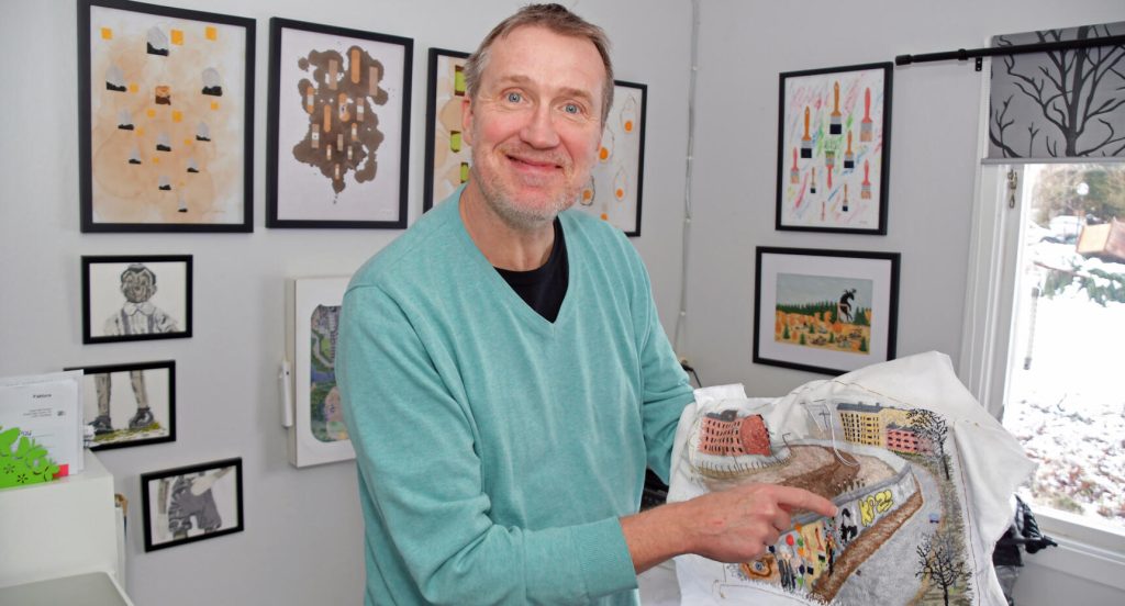 På sitt senaste verk som föreställer den gamla Berlinmuren har Krister broderat in några av sina tidigare tavlor som klotter.